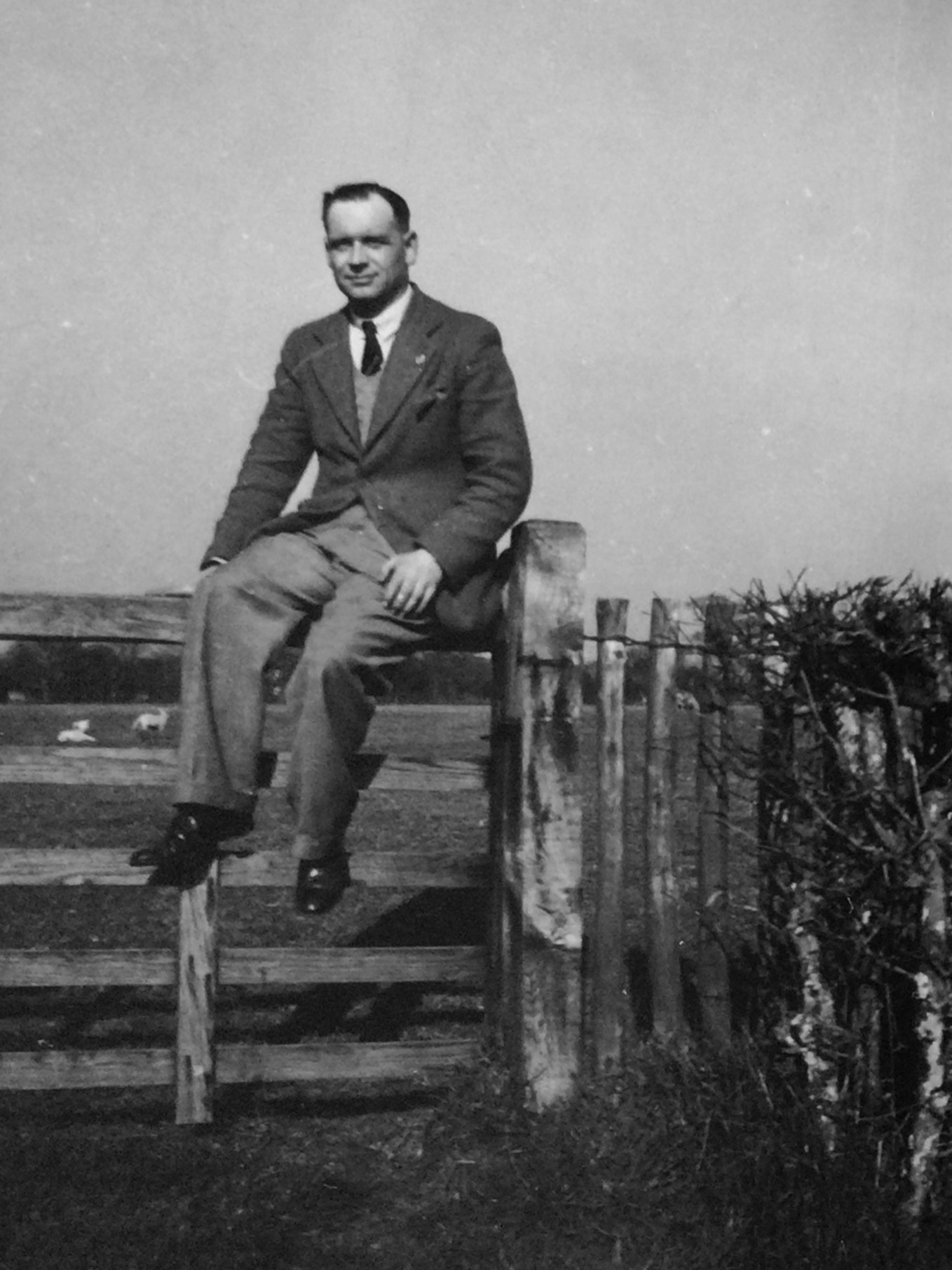 Leslie Amlot sitting on a fence.