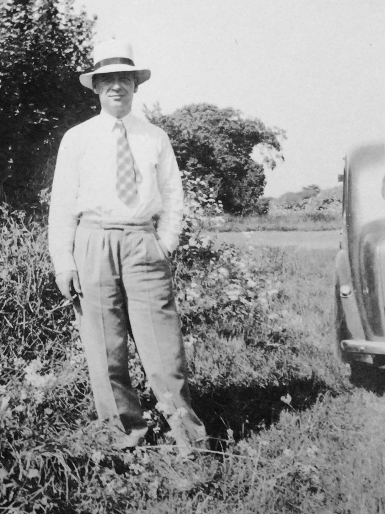 Leslie Amlot standing near a car.