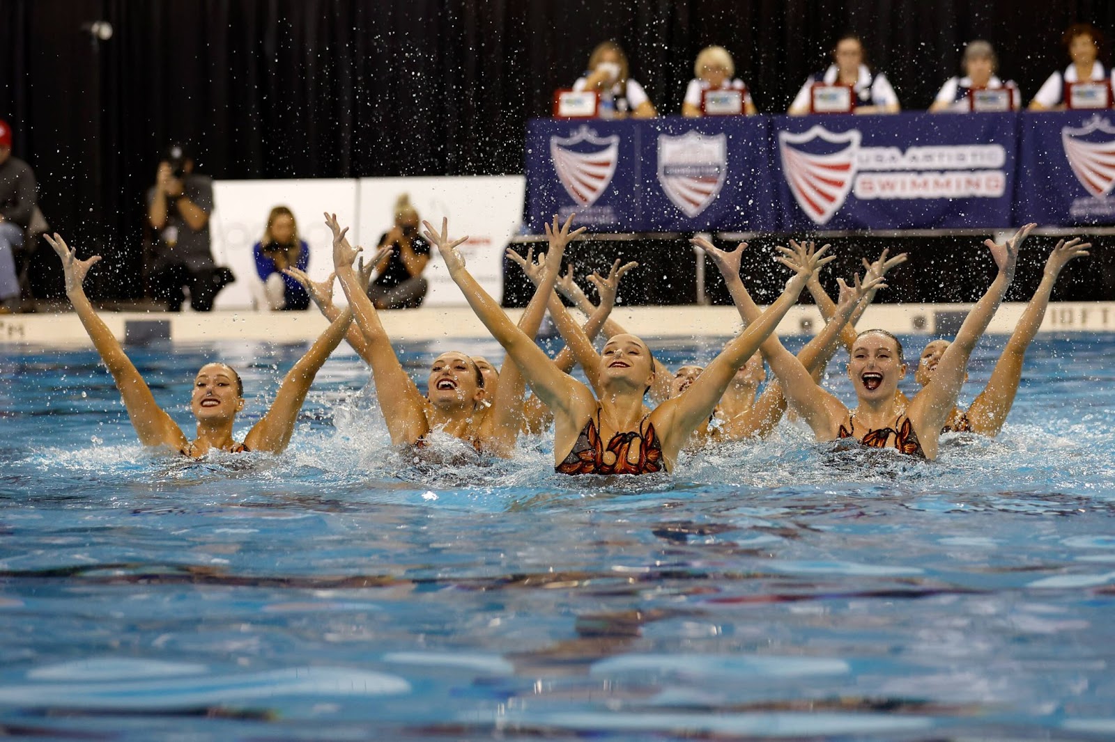 Image of a synchronized swimming team.