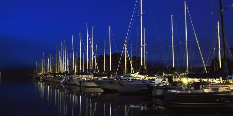 Yachts and Boat in a marina at night