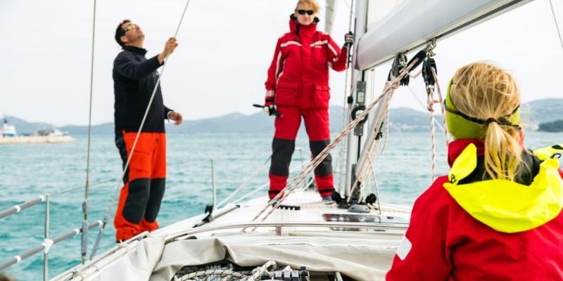 crew standing on board yacht