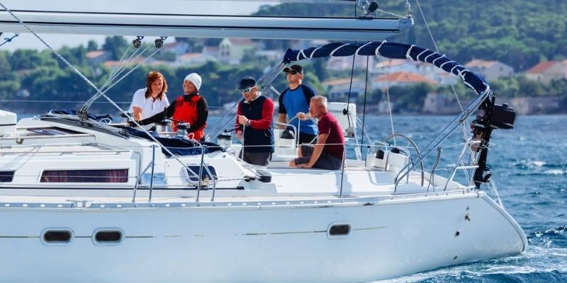 group of people on a moving yacht