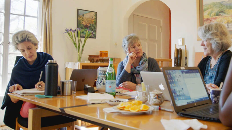 Merrill, Coeytaux and Wells of Plan C meeting around a table