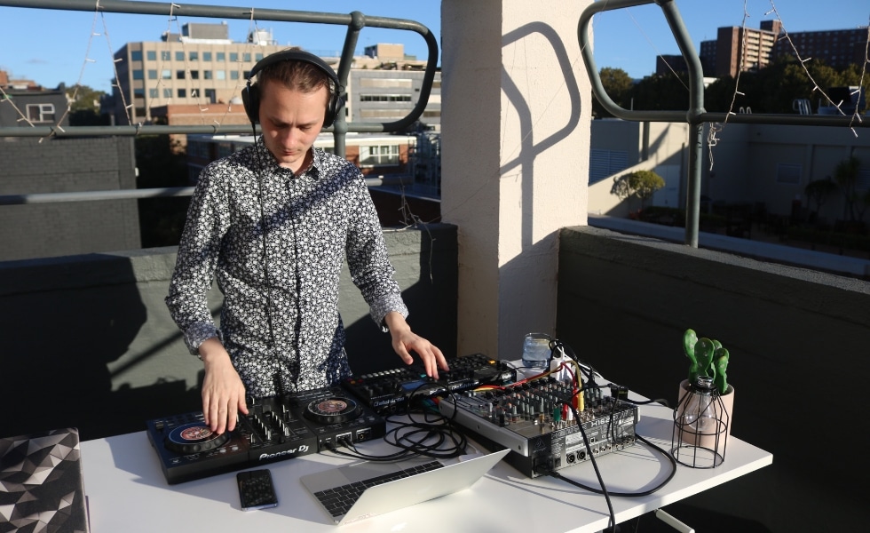 DJ at the UnLtd. charity fundraising event on the balcony at Publift HQ