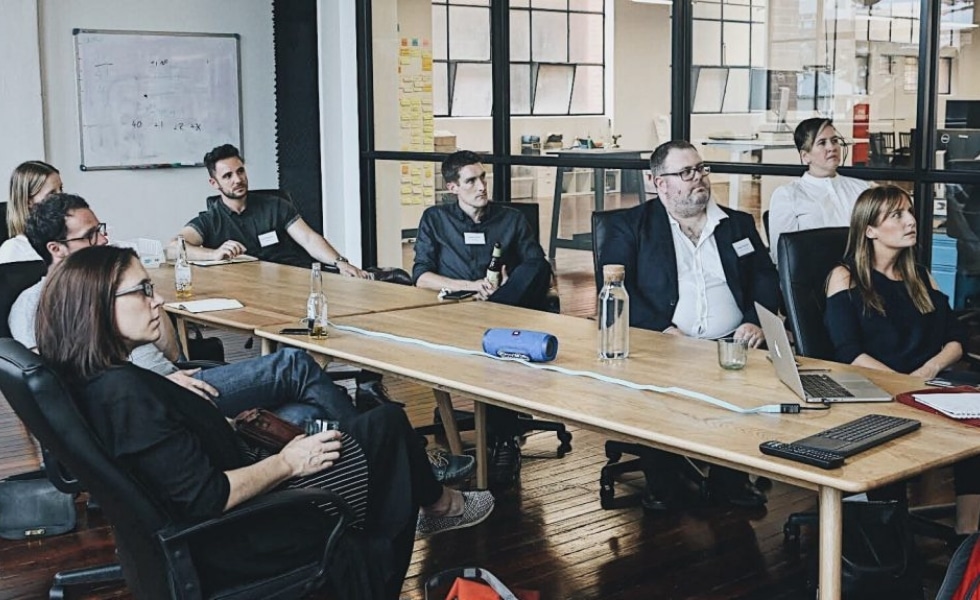 Employees watching a presentation in a meeting