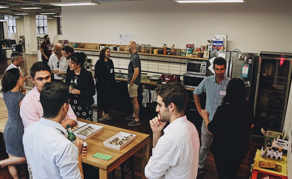 Attendees mingle at the PubComm event in Melbourne