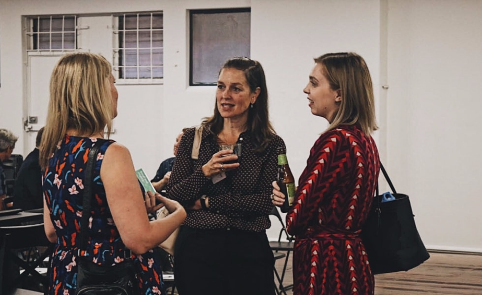 Attendees mingle at the PubComm event in Melbourne