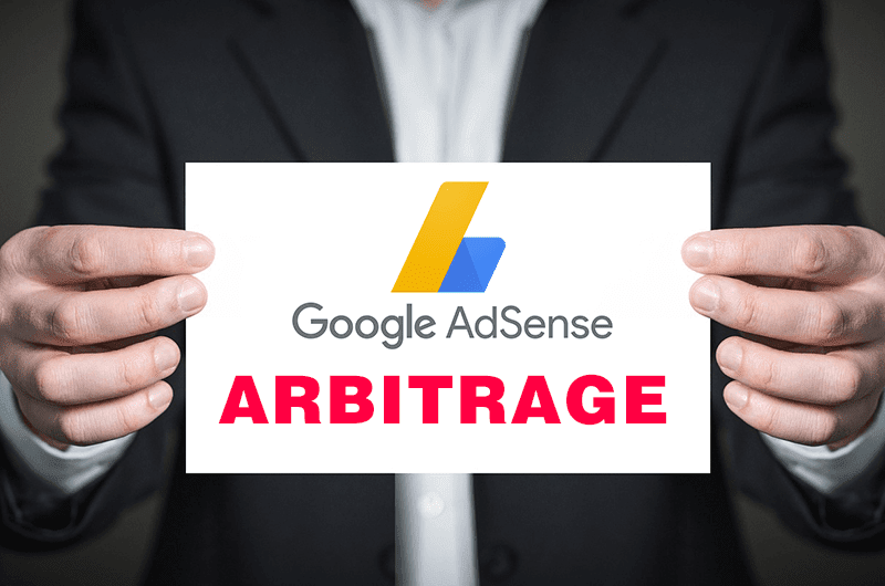 Hands holding Google AdSense Arbitrage Sign
