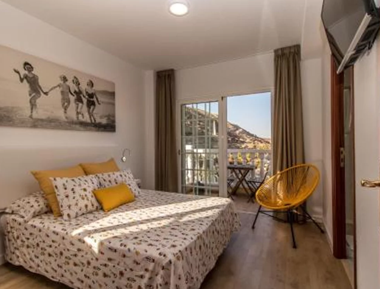 apartment bed in lovely room, mountain view out of window
