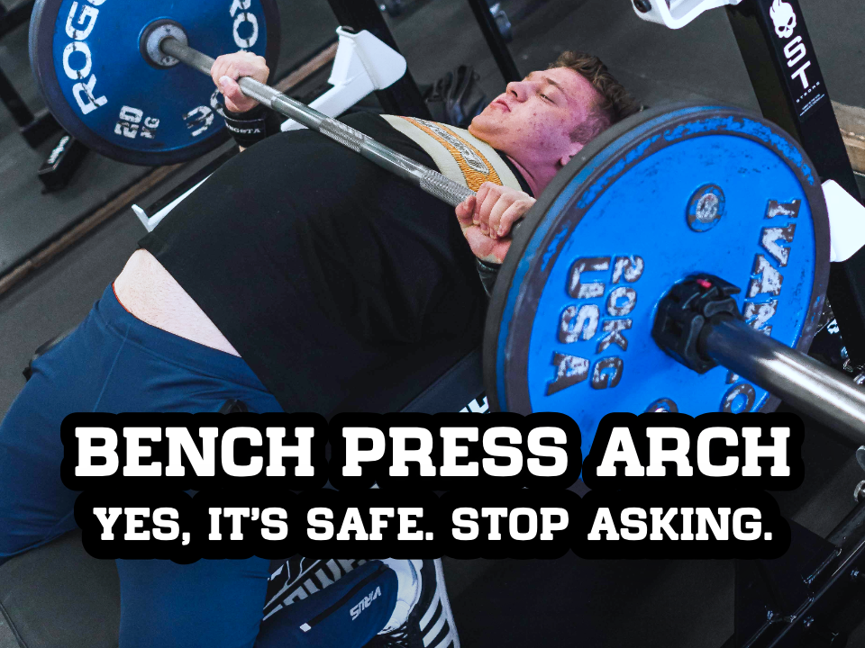man bench pressing with arched back