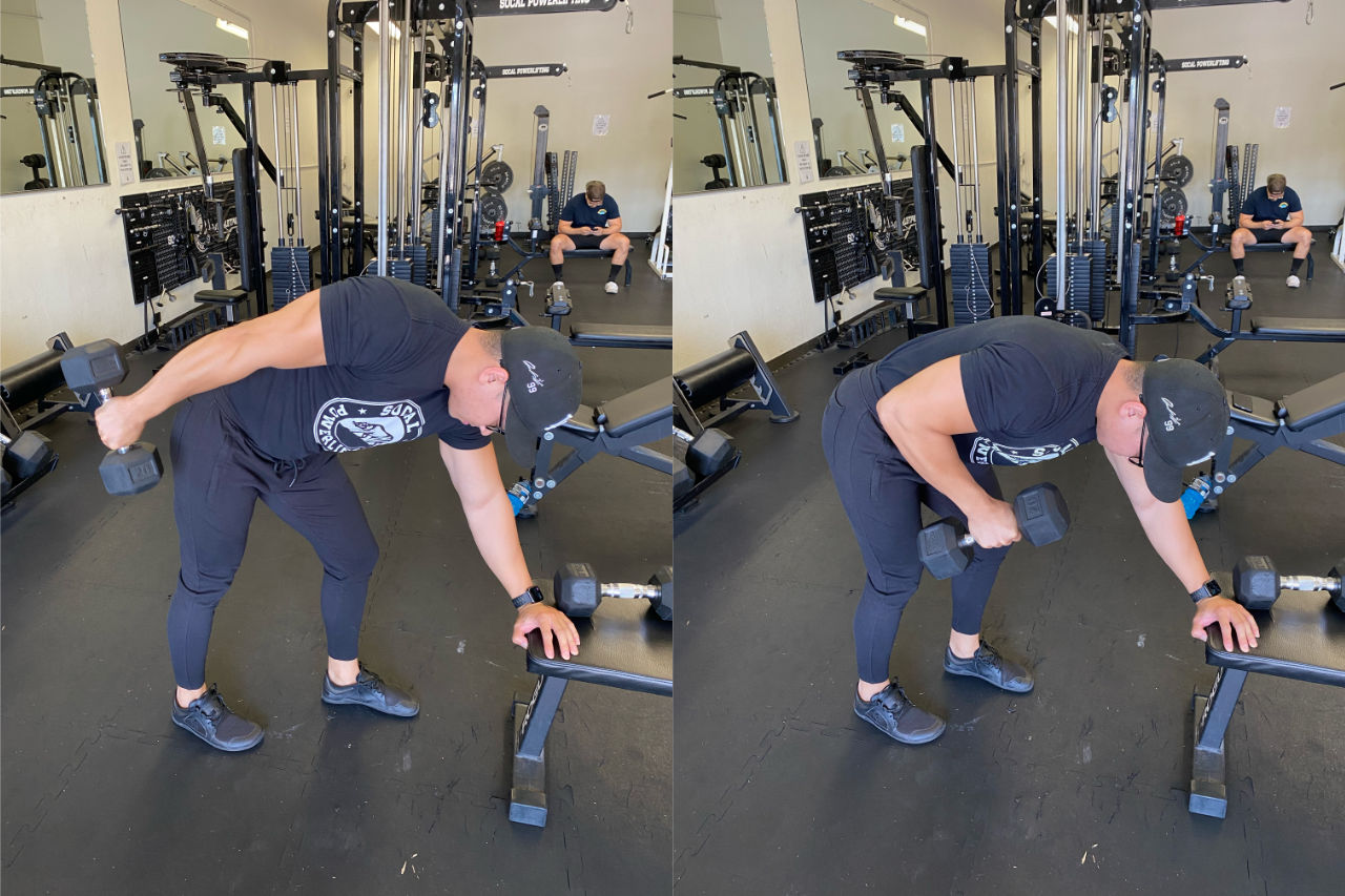 man performing dumbbell kickback