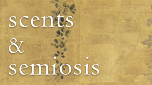 The words "Scents and Semiosis" on a stone and ivy wall