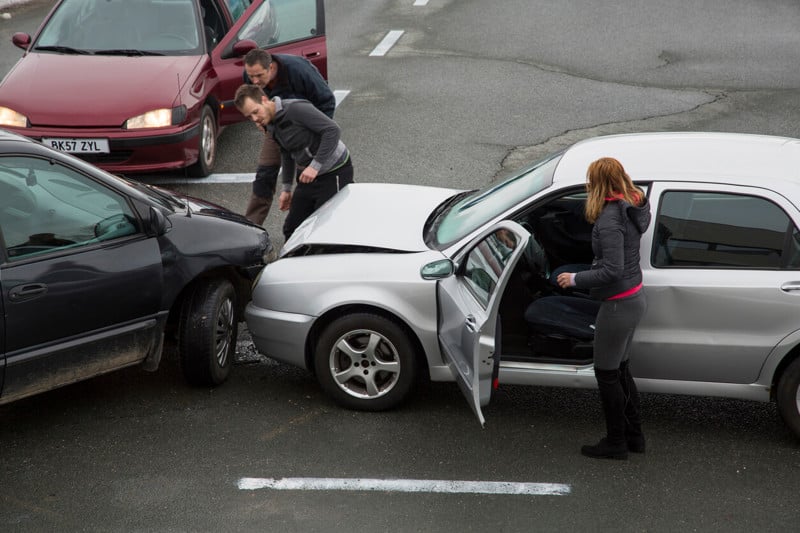 3 way collision with drivers checking for damages
