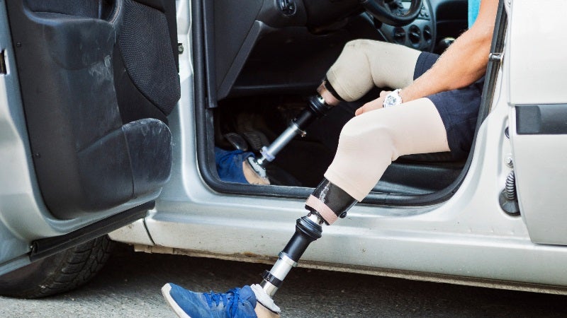 Disabled person getting into vehicle