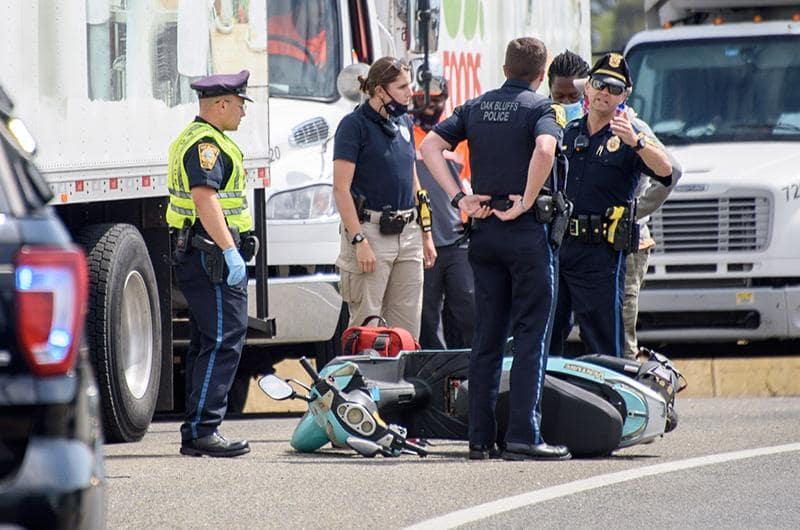 Moped accident being aided by the authorities