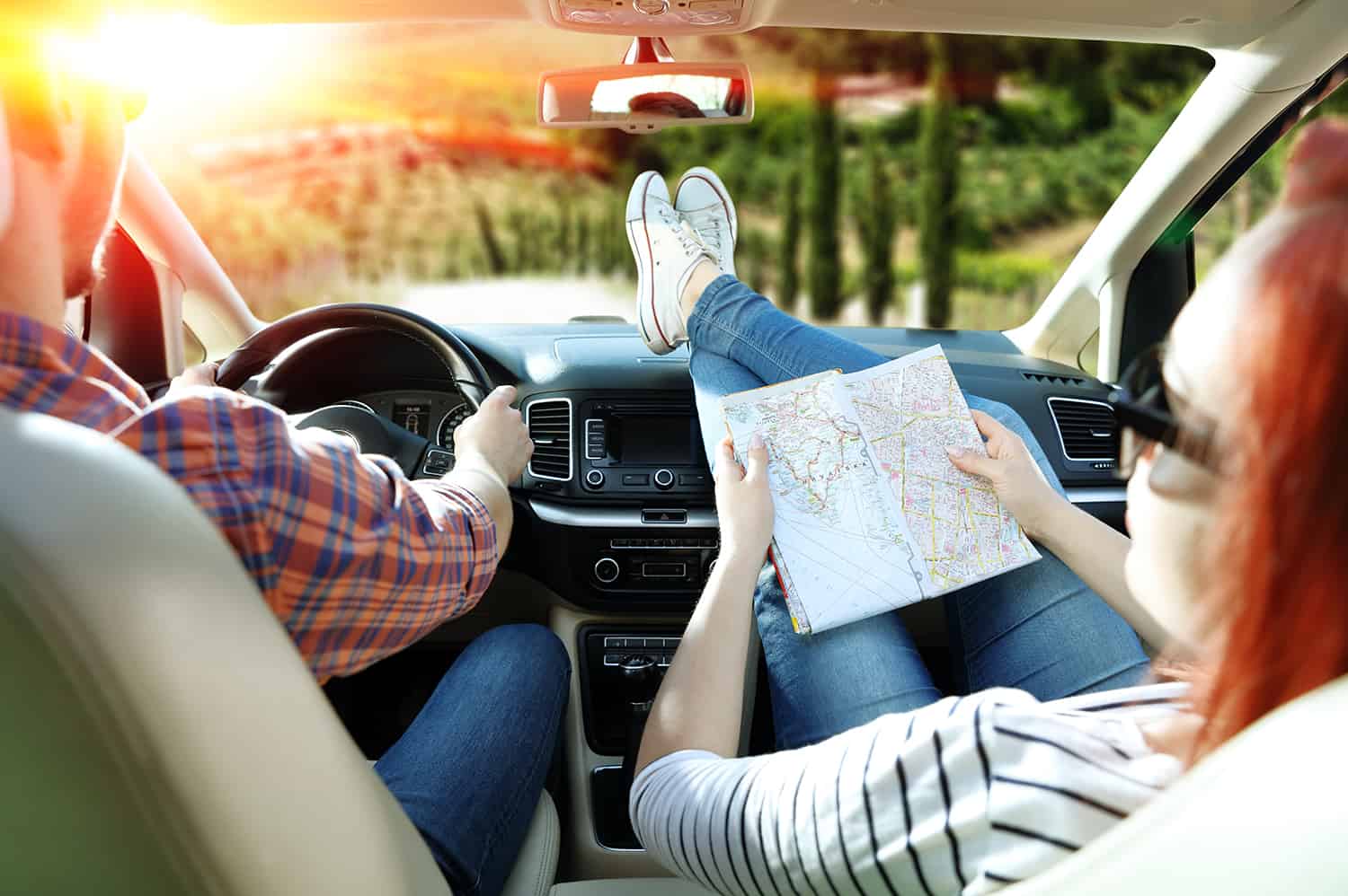 Copilot holding map for car roadtrip