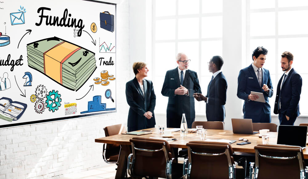 group of men discussing budget
