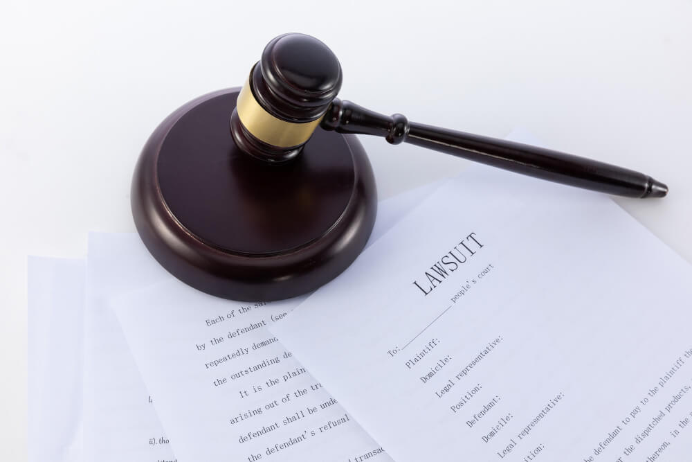 Judge's gavel  and papers of a lawsuit