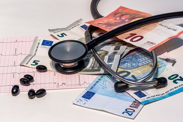 stethoscope, pills and money
