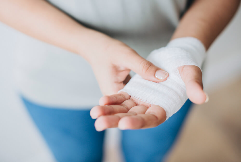 a person holding his own bandage hand 