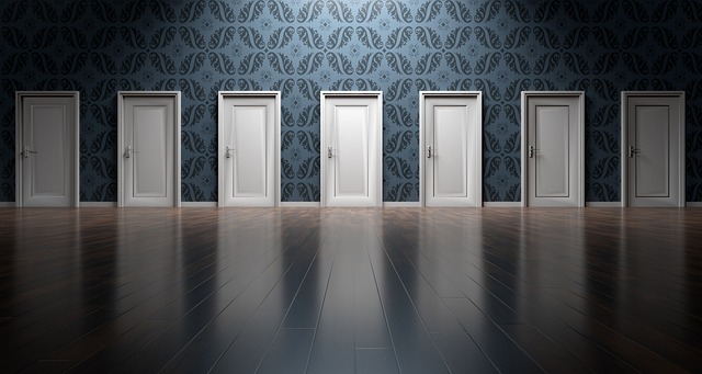 a blue wall with 7 white doors