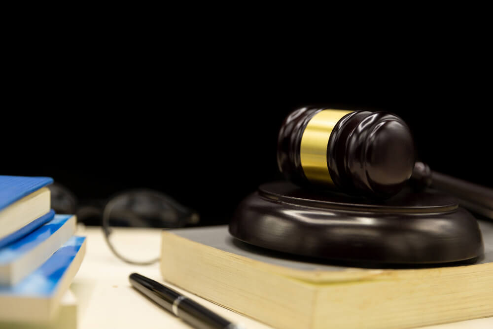 judges gavel book wooden table law justice concept background