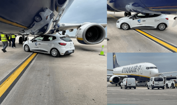 Car stuck under Airplane at airport