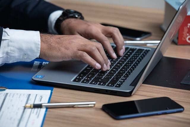 Attorney writing in a laptop. 