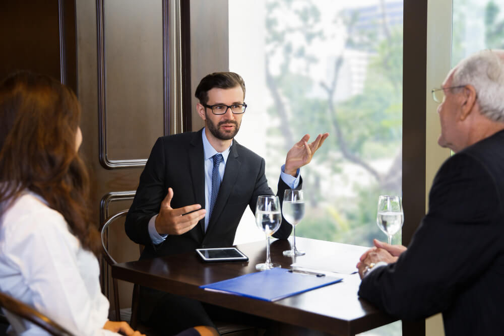 Lawyer speaking with his cients. 