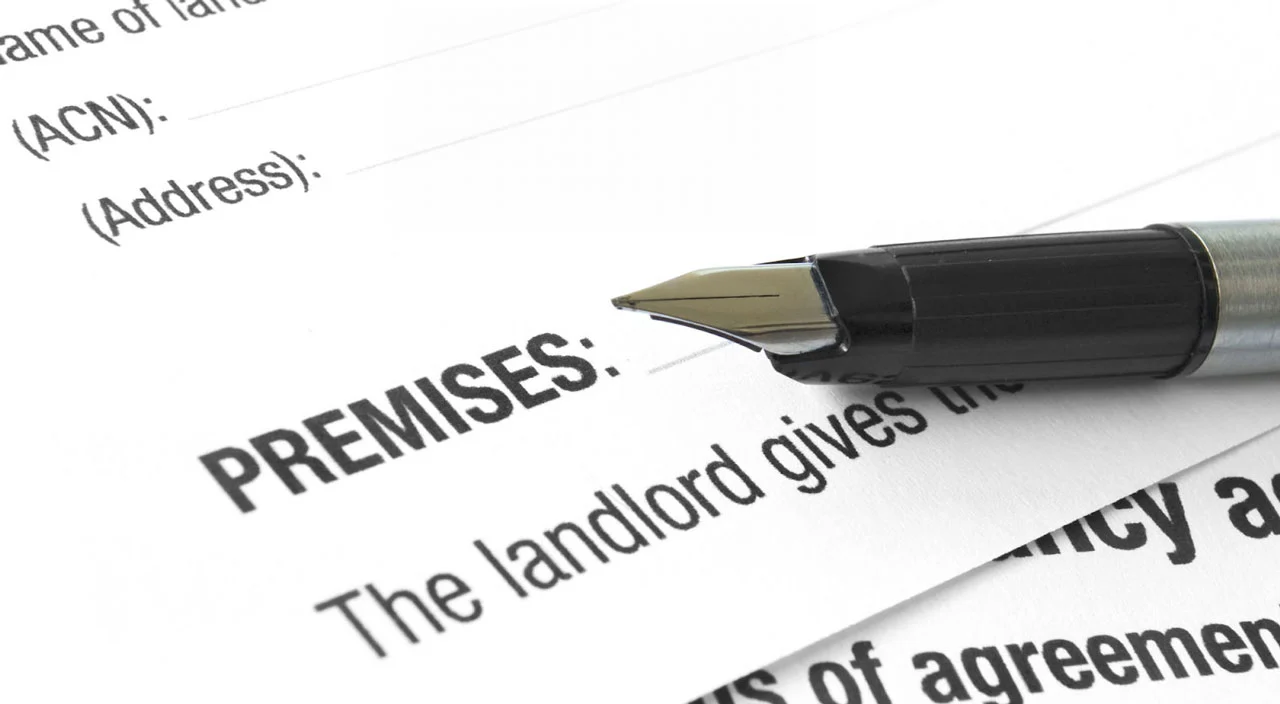Premises liability legal documents with fountain pen sitting on top. 