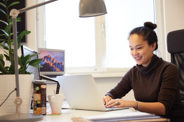 Woman working at here laptop