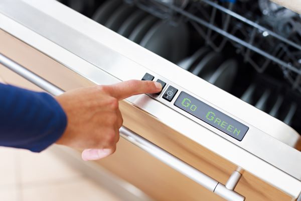 Button on machine being pressed