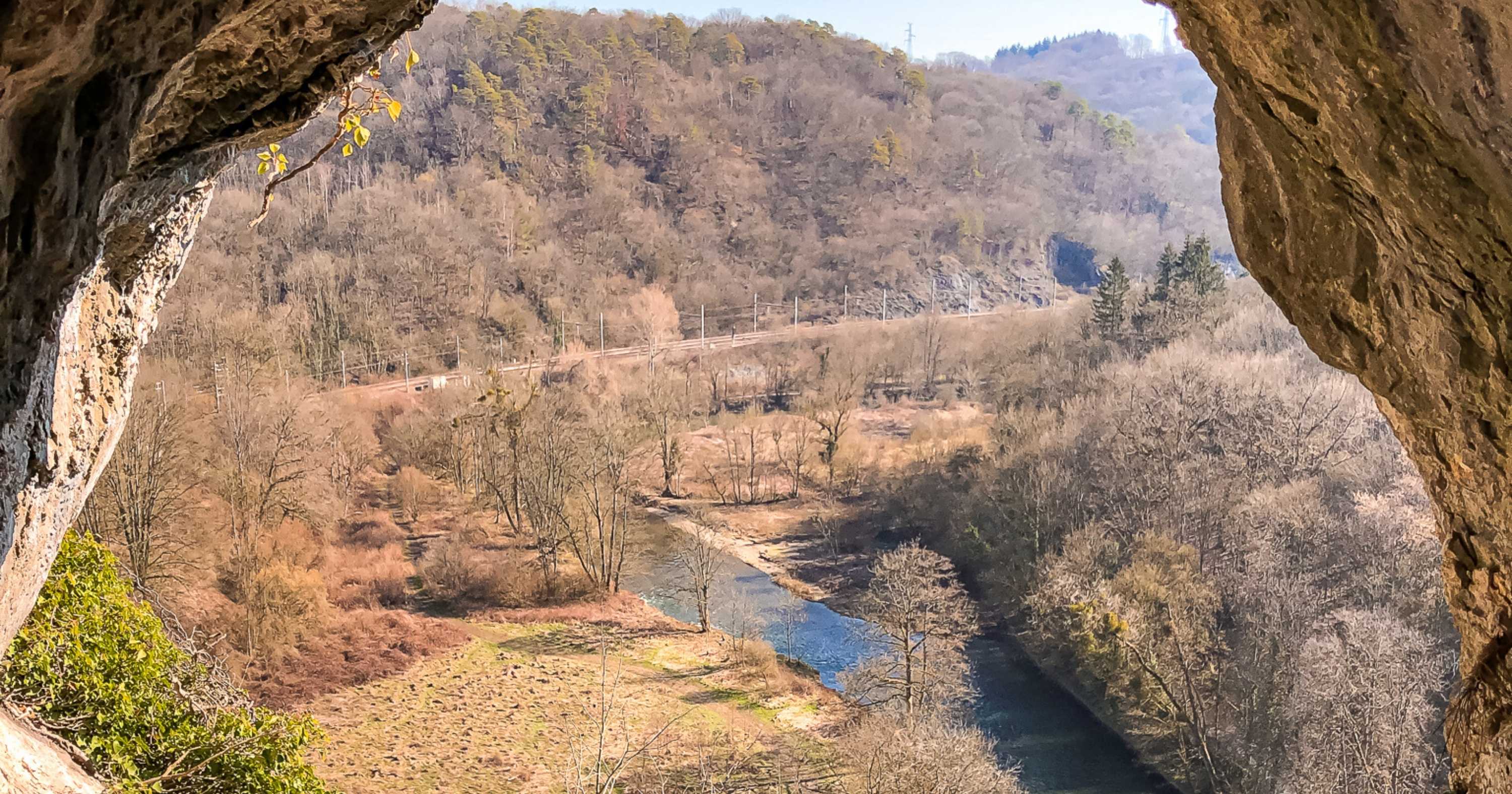 A view of a tree-covered valley in Belgium from a viewpoint at Park Furfooz