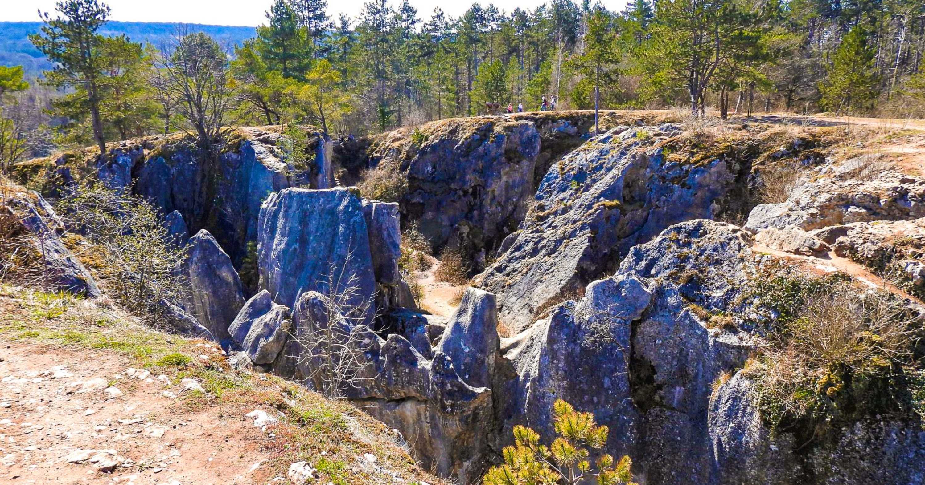 A unique rock formation forming a large dip in the ground at Fondry des Chiens, Belgium