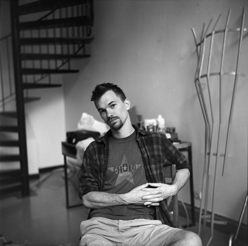 emanuel ehgartner in his studio infront of a sculpture
