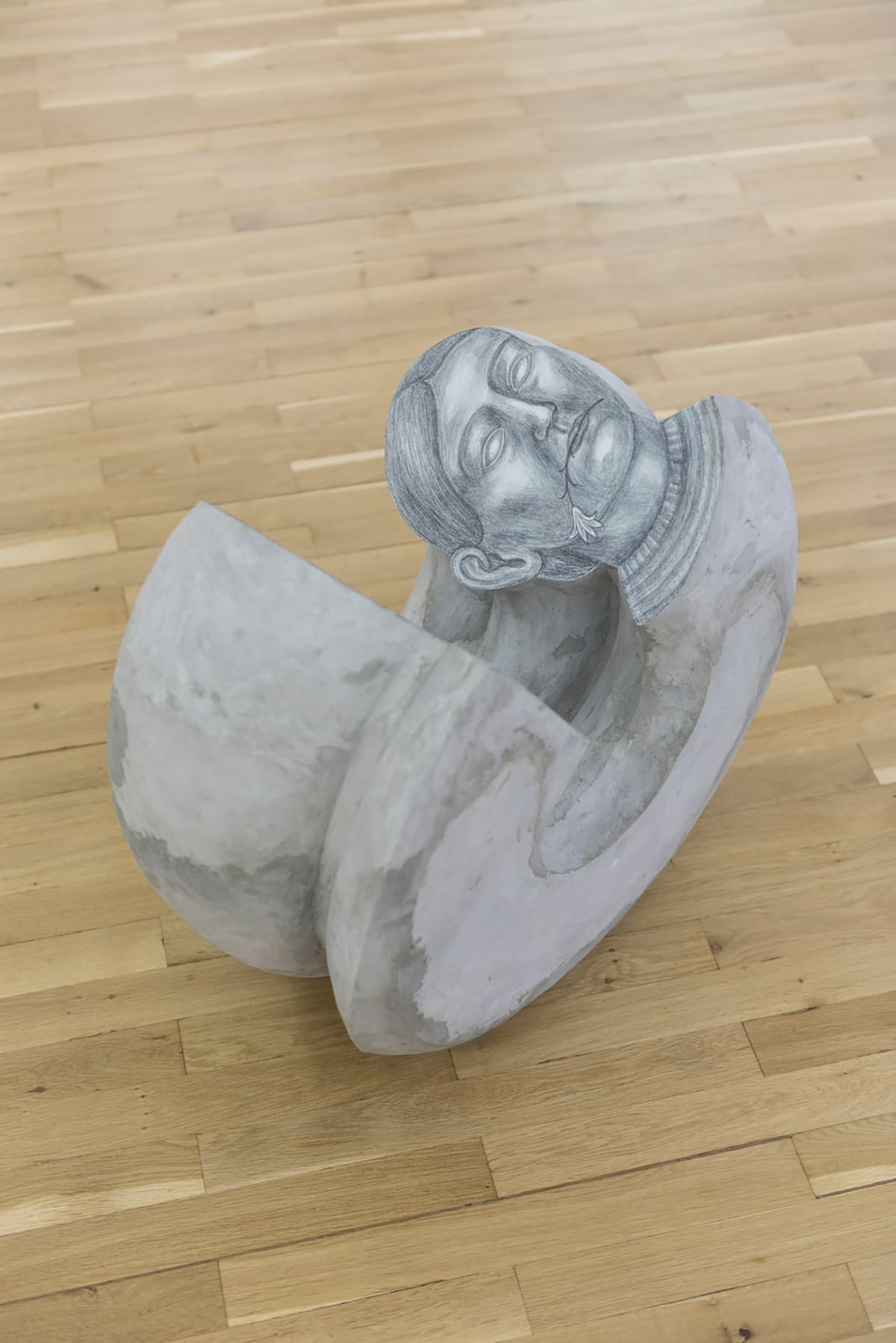 Image shows sculpture of a woman like snail