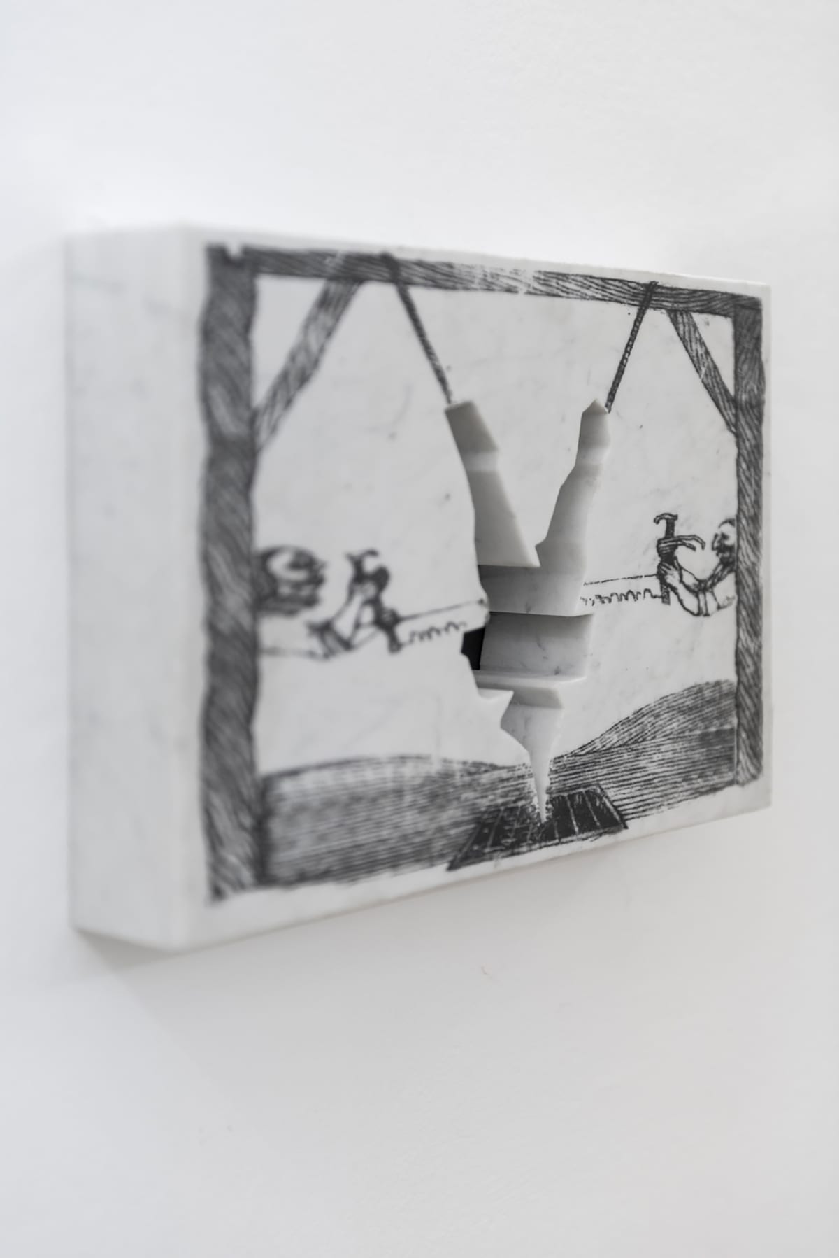 Image shows small artwork marble with a photo transfer and a piece has been cut out in the form of a man
