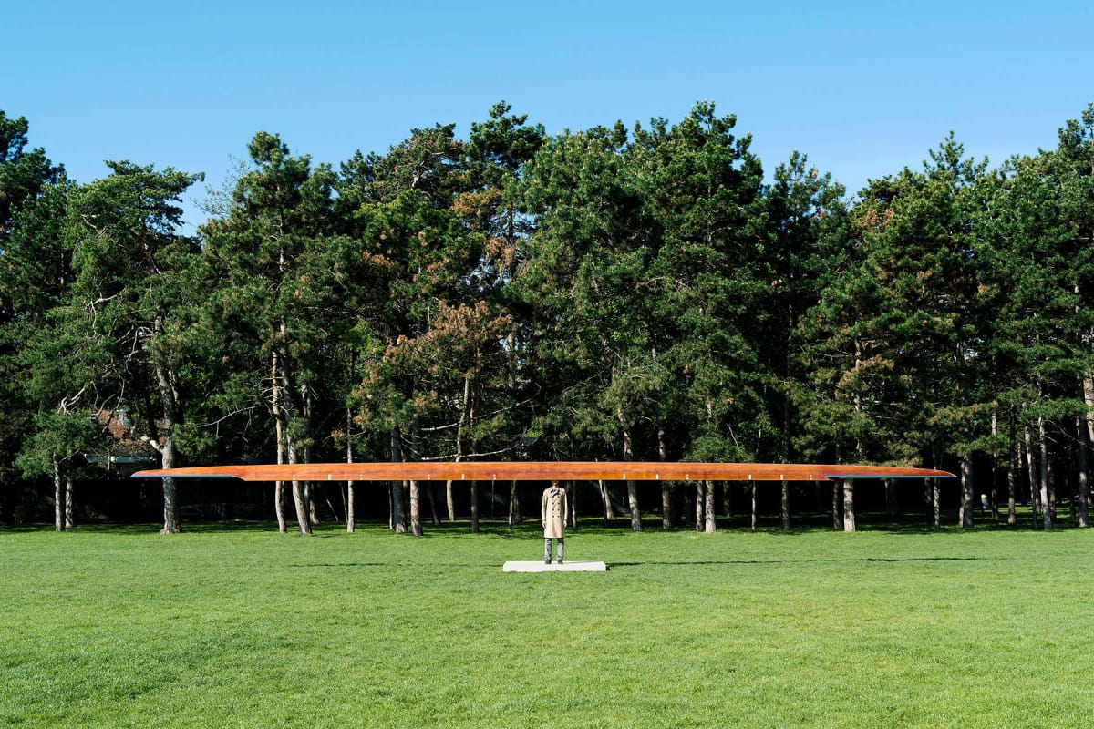 public art, roman pfeffer, viewing room, art, ,outdoor scene in a park of a sculpture of a man without a head and a rowing boat