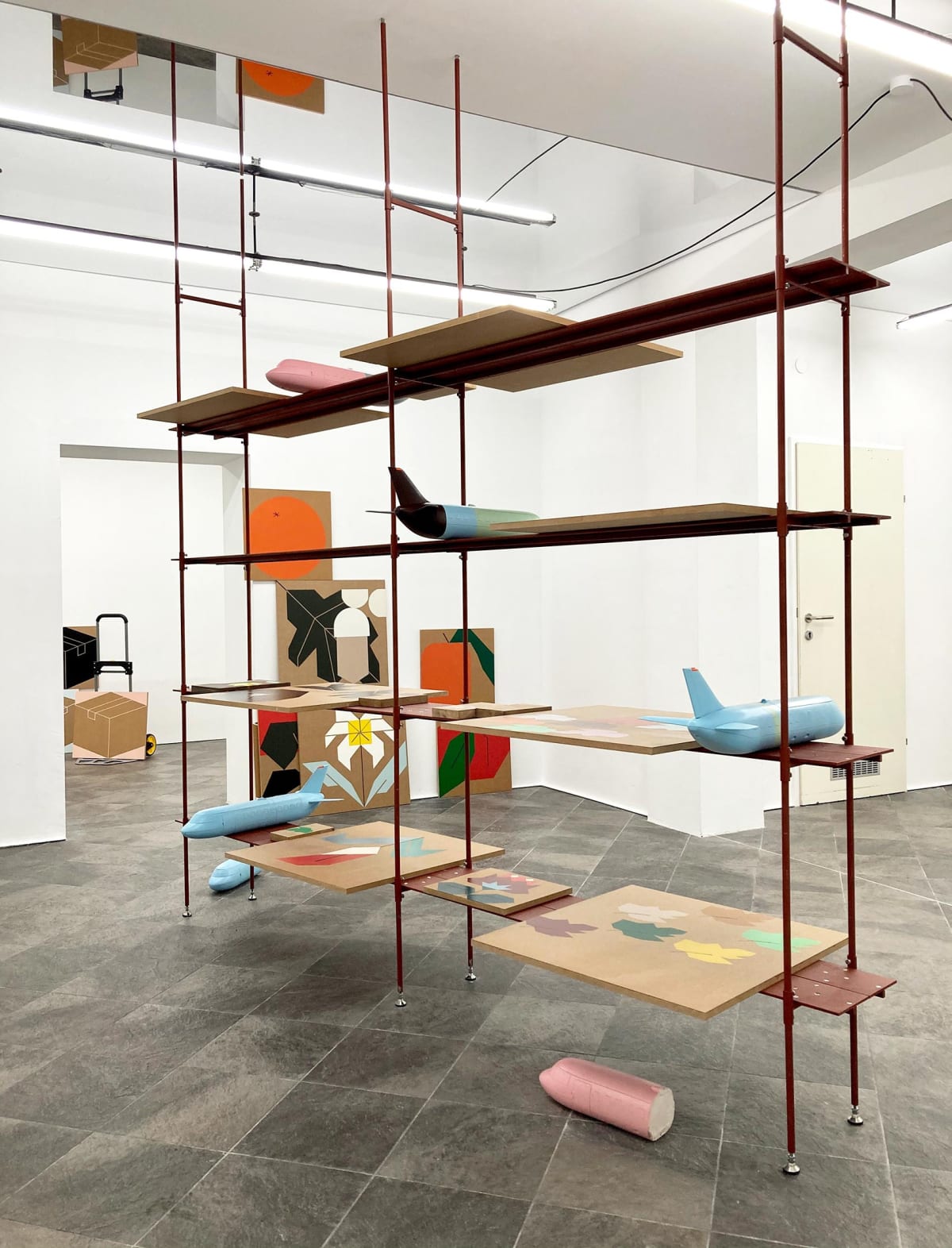 image shows shelves with artwork from the artist Siggi Hofer.