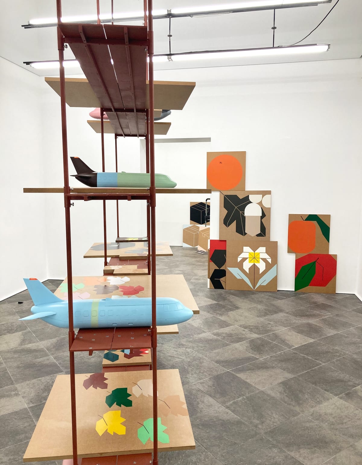 image shows shelves with artwork from the artist Siggi Hofer.