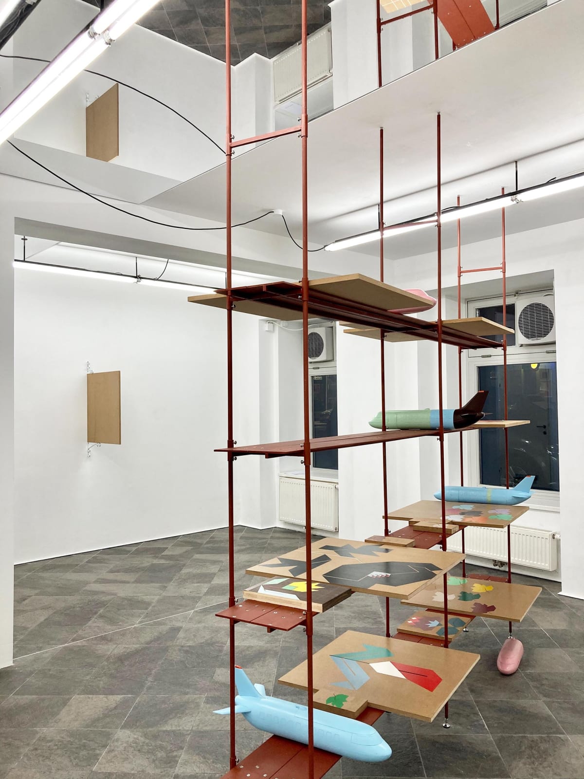 image shows shelves with artwork from the artist Siggi Hofer.