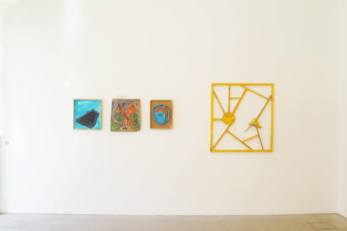 ernst koslitsch raum mit licht exhibition in vienna image shows three small colorful framed paintings and one larger yellow wooden sculpture