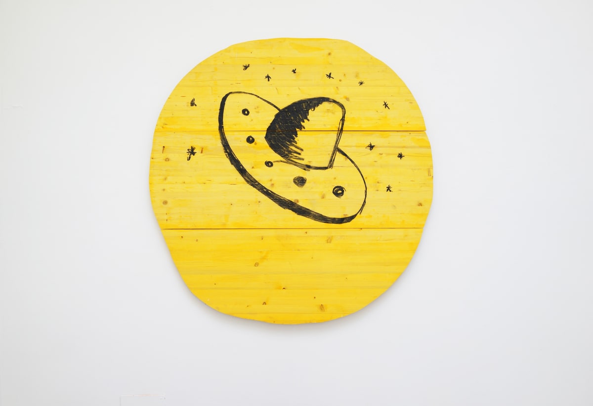 ernst koslitsch raum mit licht exhibition large wooden yellow circle with a sombrero drawn in black or is it a ufo?