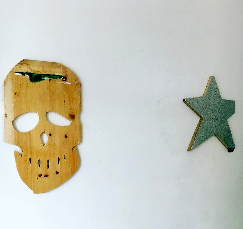 platform, artist to watch portrait , skull, star, wooden objects, wall,