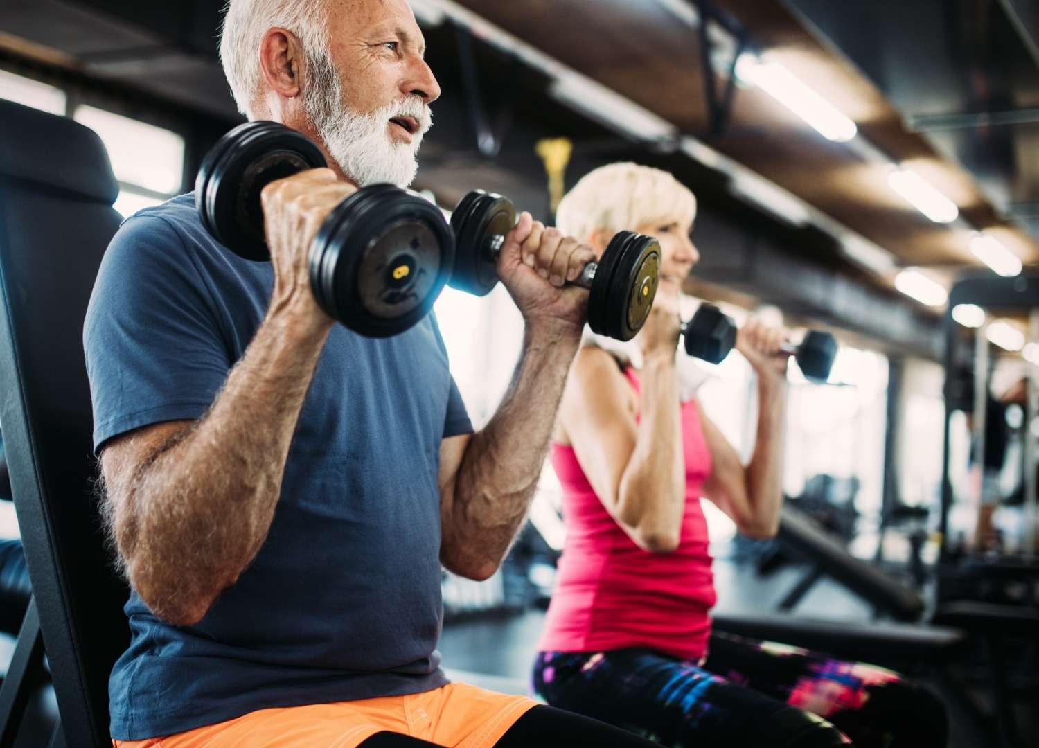 An old man lifting dumbbells