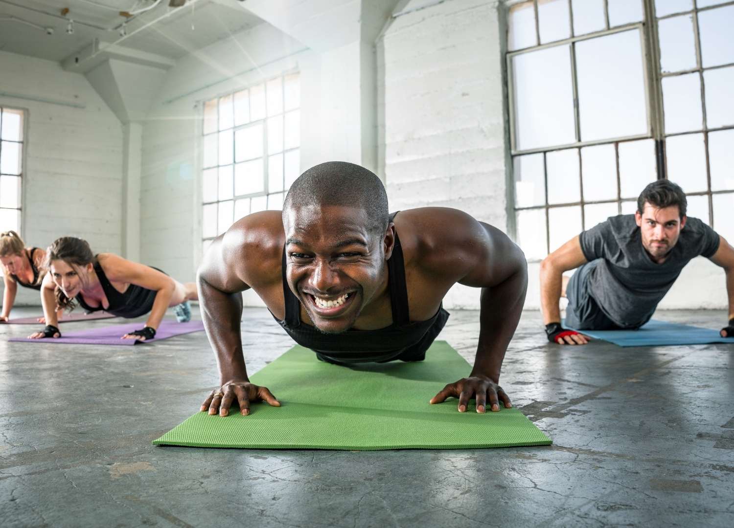 Group of people carrying out a push-up challenge