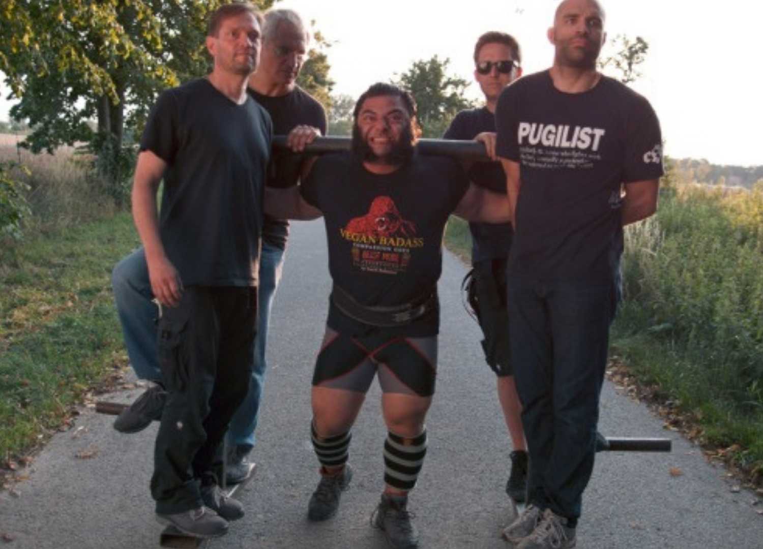 A group of body builder posing for camera