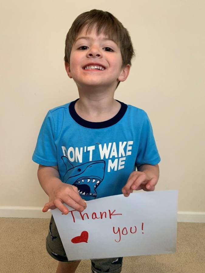 Employees and their families thank healthcare heroes with handmade signs