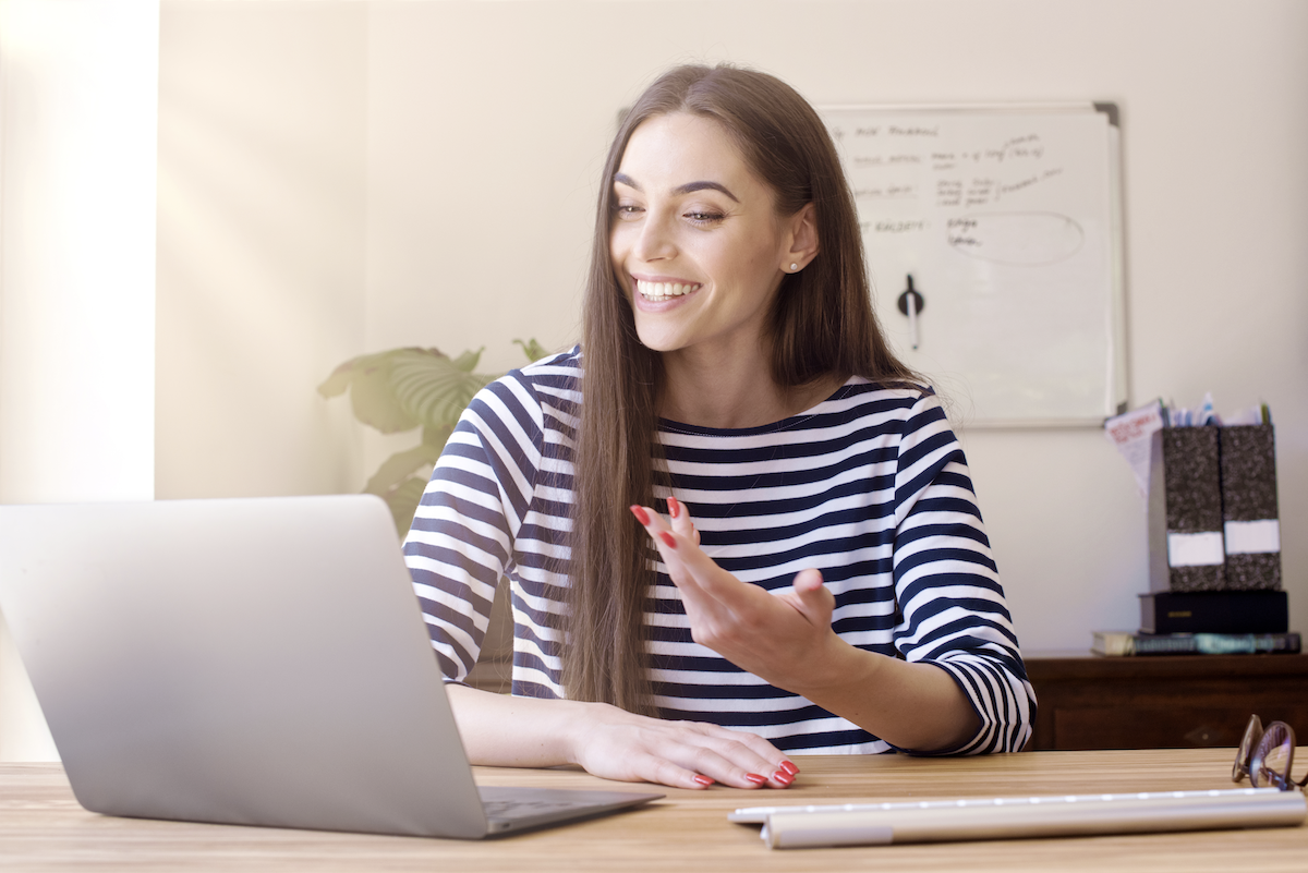 consultative selling: woman having a video call using her laptop