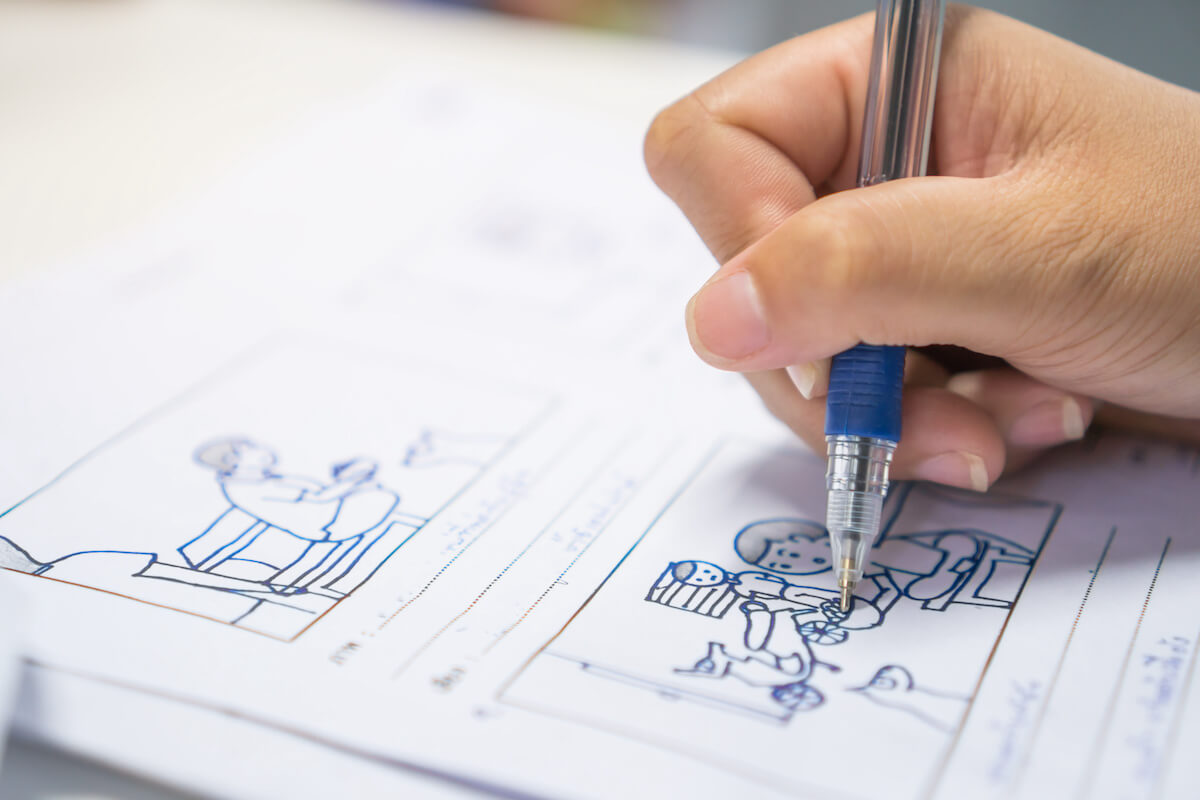 Explainer video software: person drawing a storyboard